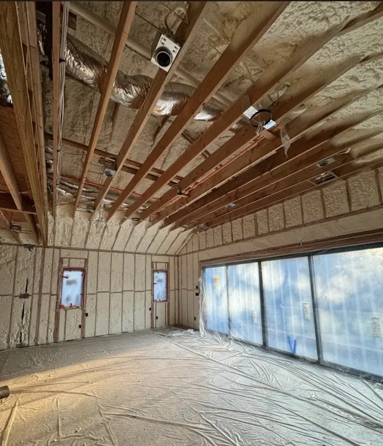 Interior walls and ceiling insulated with spray foam during new construction in Harvard